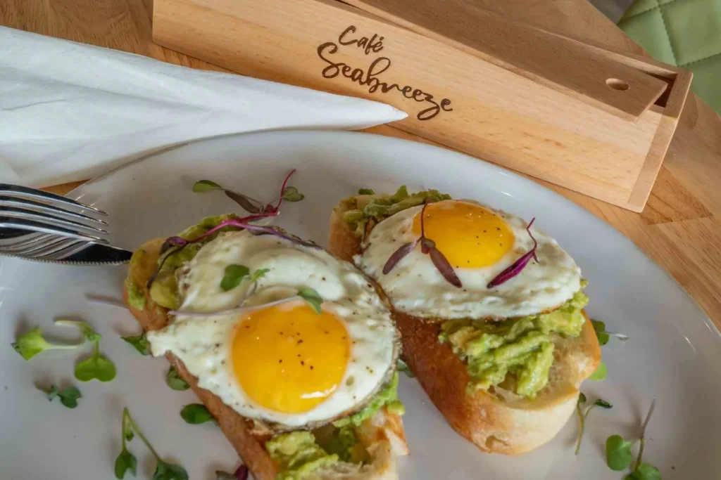 2 fried eggs on avocado toast