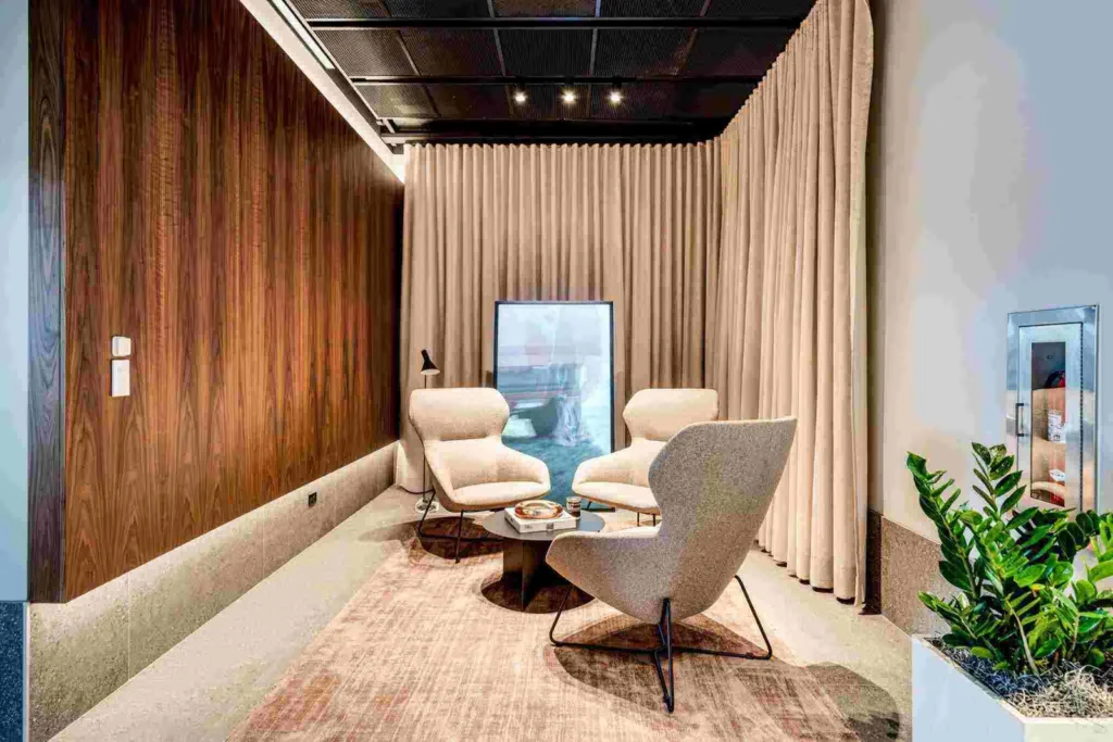 3 chairs seating area inside Porsche Studio Naples