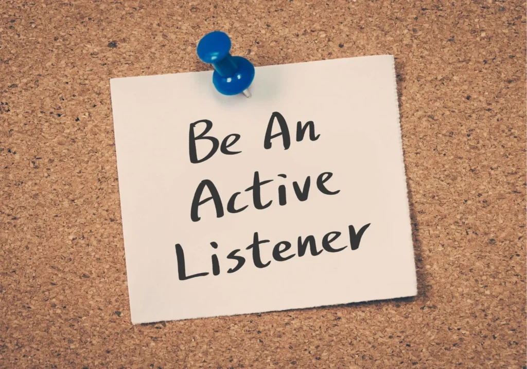 A sticky note that says, be an active listener.