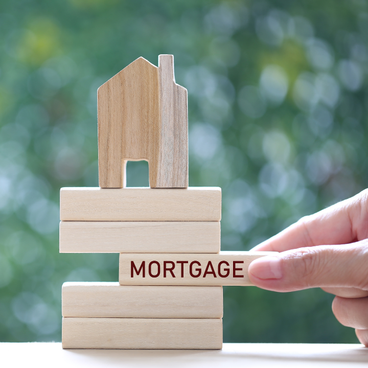 A wood house with word mortgage