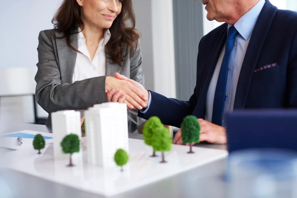 agent shaking hands with client