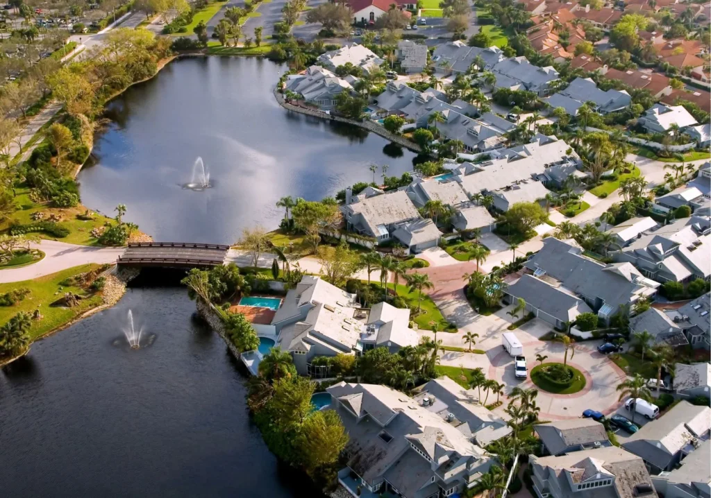 Arial view of large water body with bridge and homes