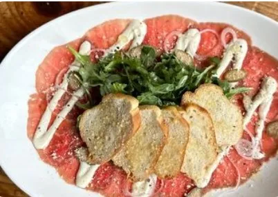Beef carpaccio with arugula and crisps at Taberna Burntwood