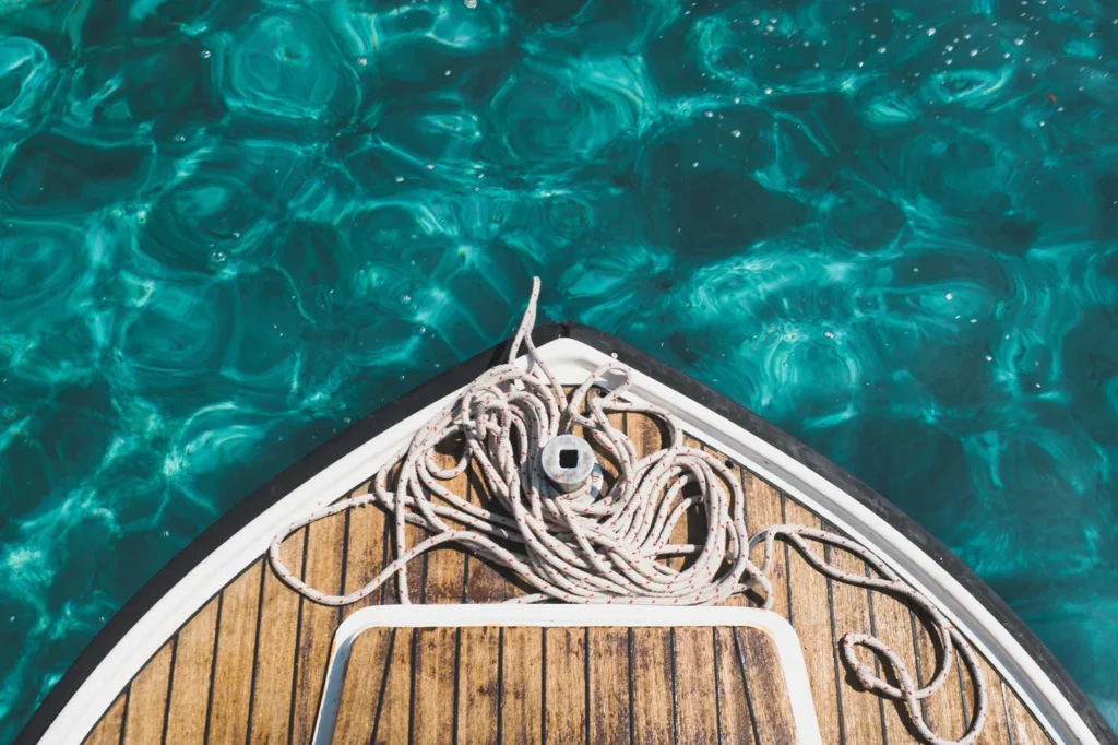Bow of a boat over turquoise water
