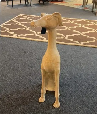 Carved dog statue decor at 41 Home and Garden