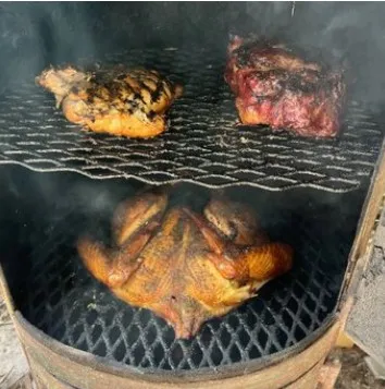 Chicken grilling on the BBQ at Backyard Fire Grill