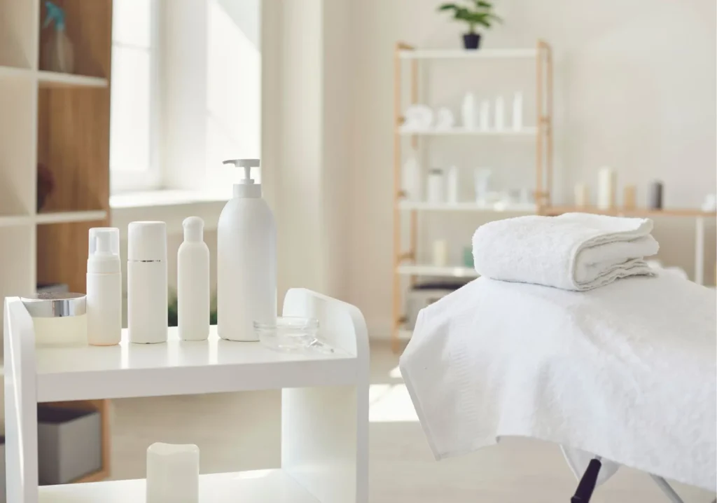 Clean white spa room with table