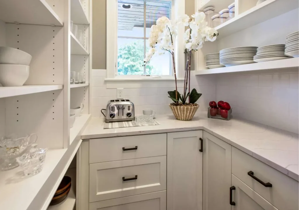 Coffee bar space with white cabinetry