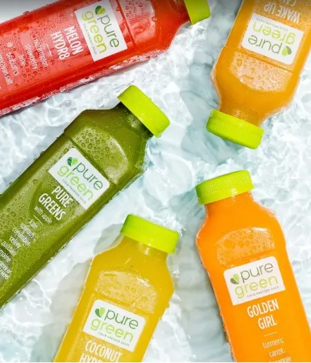 Collection of bottled juices on ice