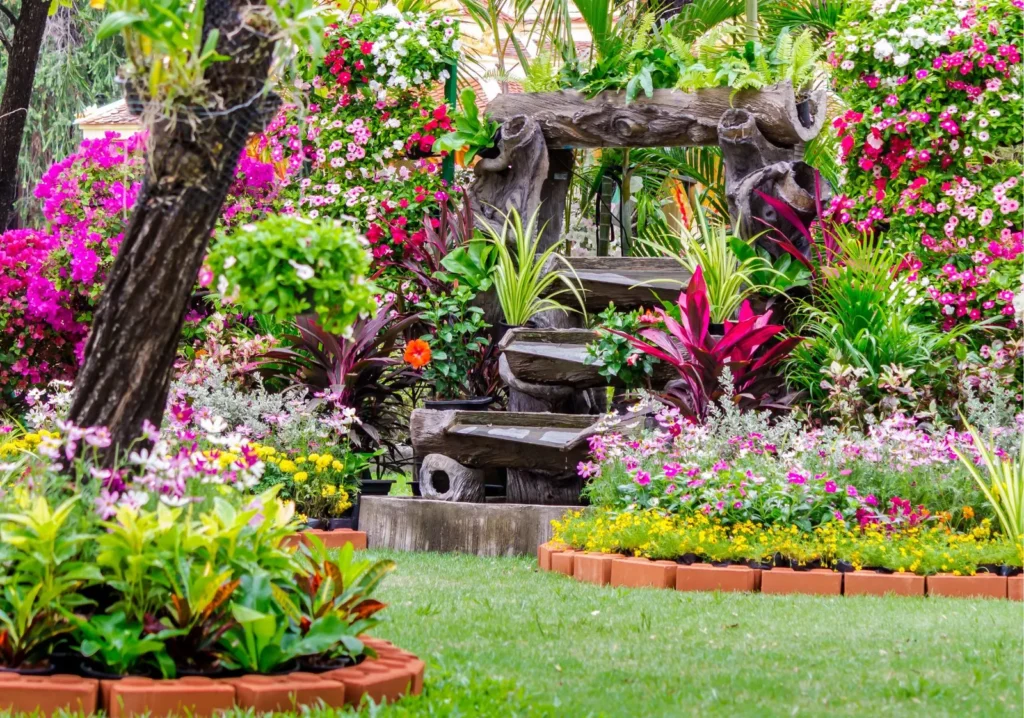 Colorful tropical garden with a stone water feature
