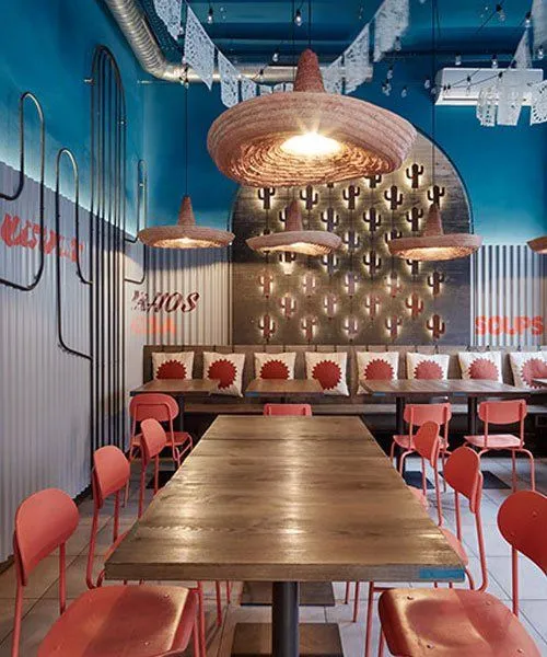 Communal table and pendant lights in the Crazy King Burrito dining room