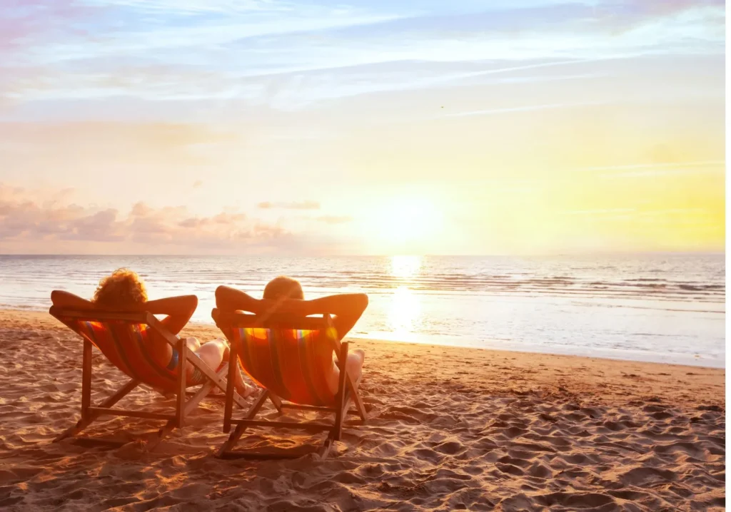 Couple watching beach sunset