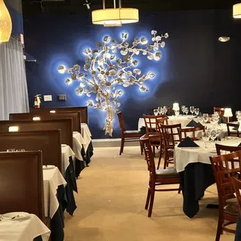 Dining room with illuminated wall art at Amber Cove restaurant