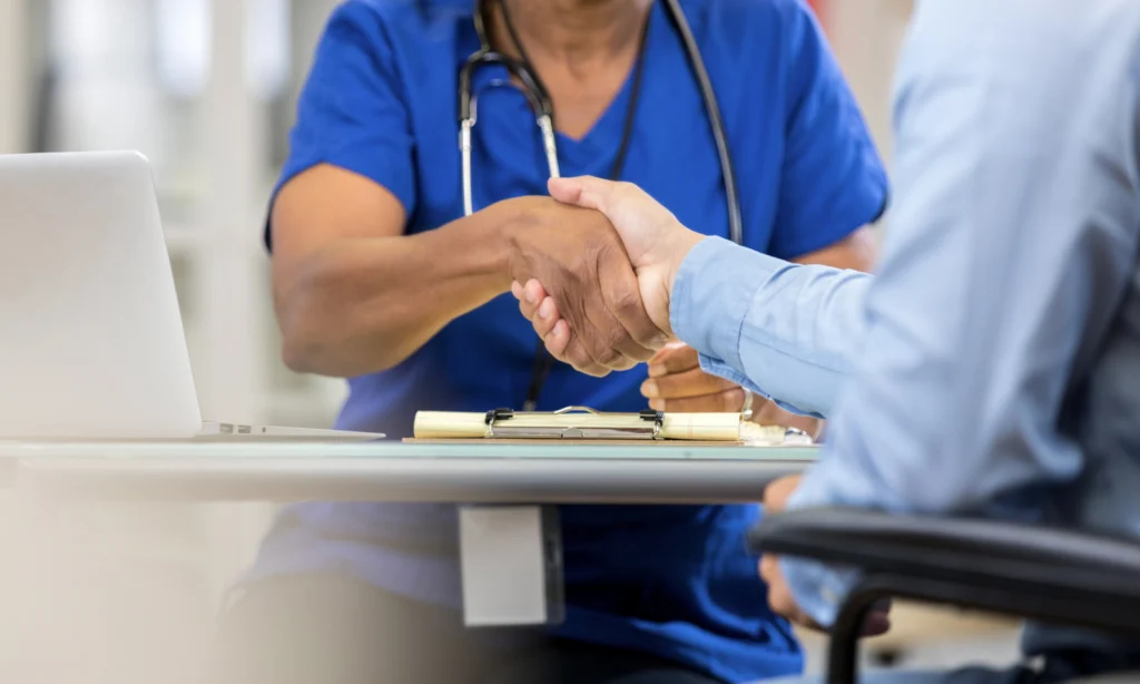 Doctor shaking patient's hand