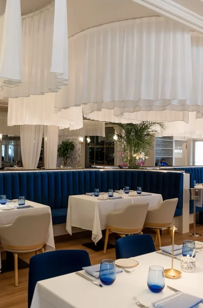 Elegant dining room with white tablecloths at BiCE Naples