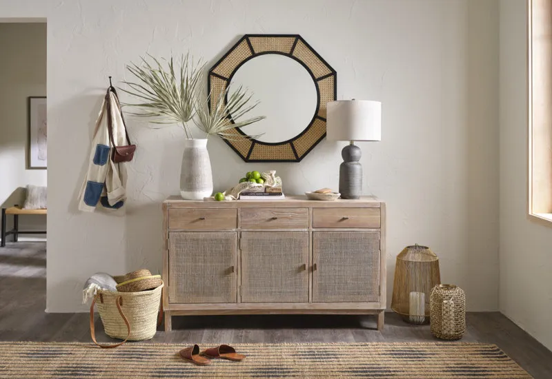 Entryway with rattan cabinet and mirror from Birch Lane