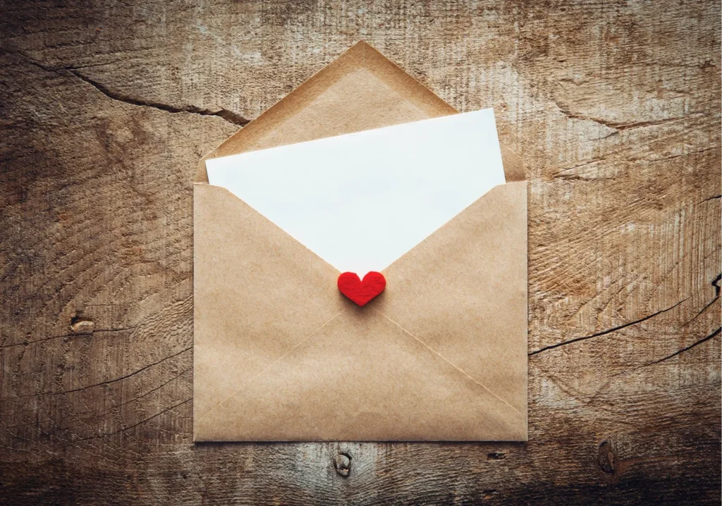 Envelope opening with letter and heart