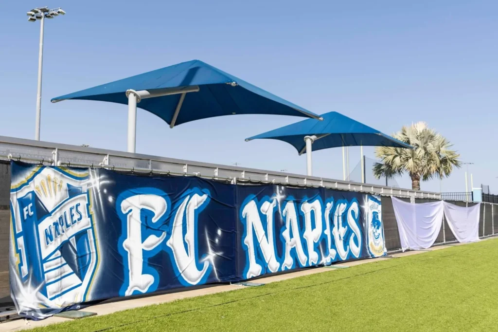 FC Naples banner along the soccer field