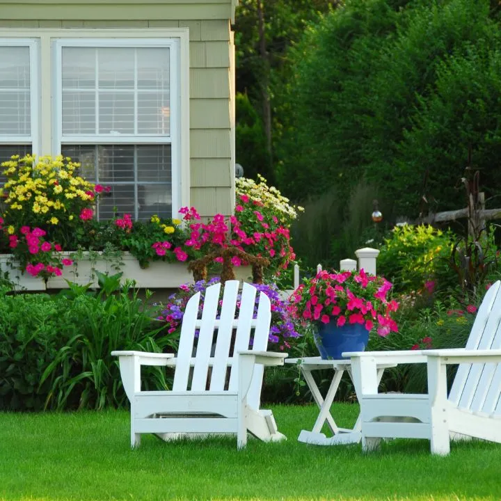 Garden with flowers and Adirondack chairs