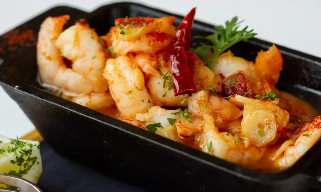 Garlic shrimp in a cast iron dish at Paella's