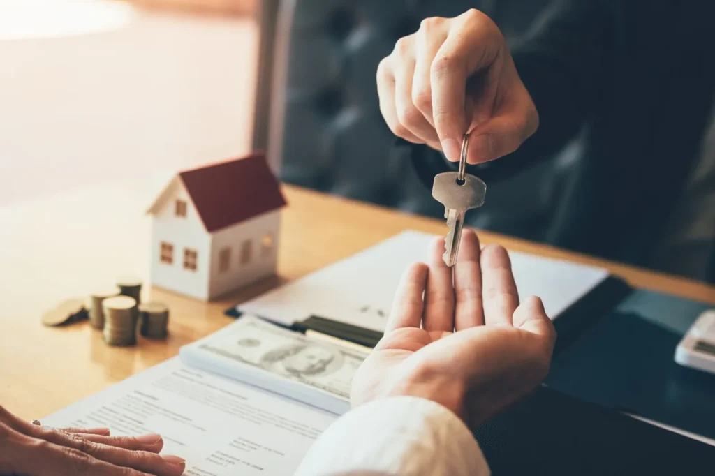 Handing over house keys at closing