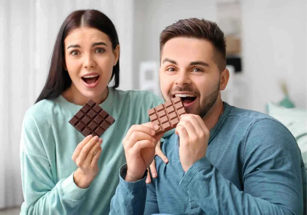 Happy Couple eating chocolate