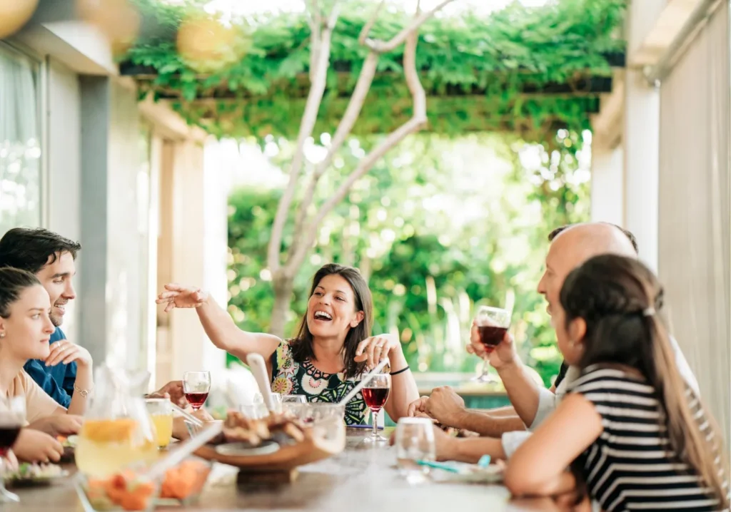 Happy Friends Enjoying Wine Outdoors