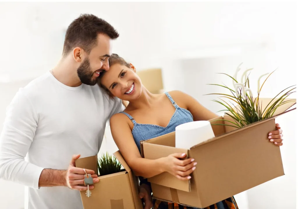 Happy home buyers moving into new home