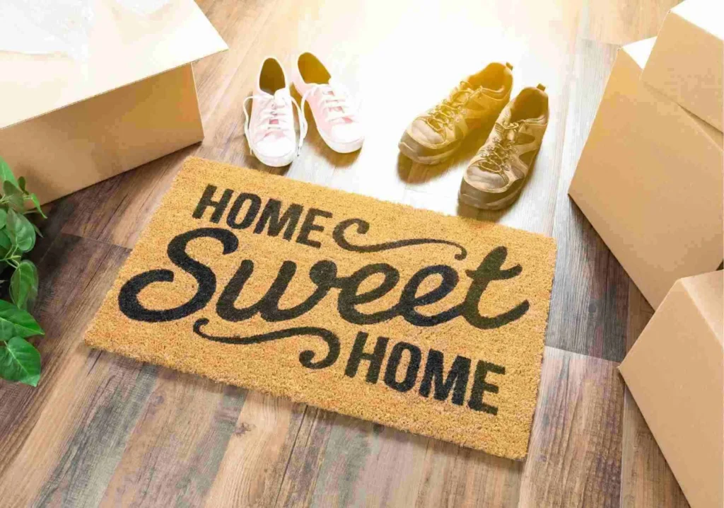 Home Sweet Home welcome mat with man's and woman's shoe pairs