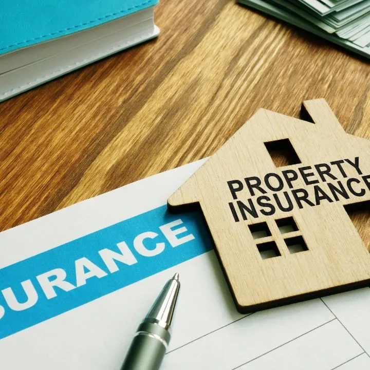 Insurance paper and property insurance sign
