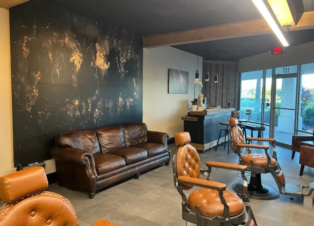 Leather barber chairs and lounge sofa at NUBREED Barber Studio