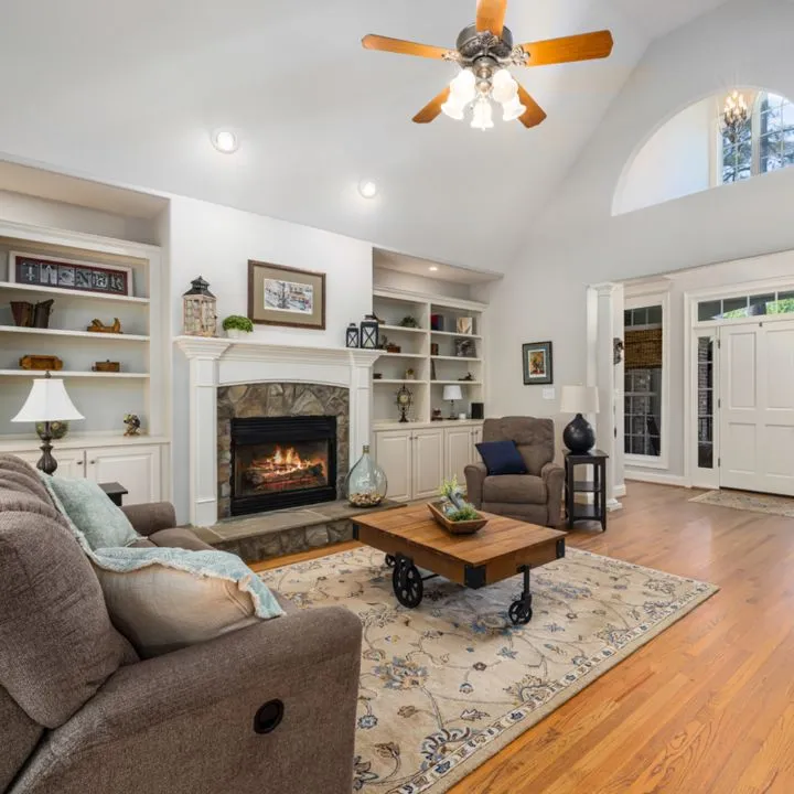 Living room with fireplace and built-in shelves