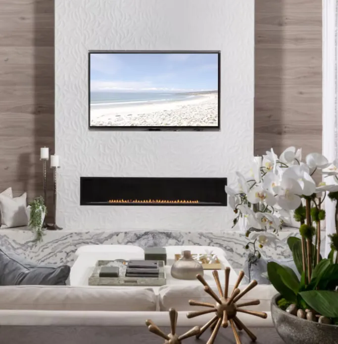 Living room with linear fireplace and white orchids styled by Abodeable Home