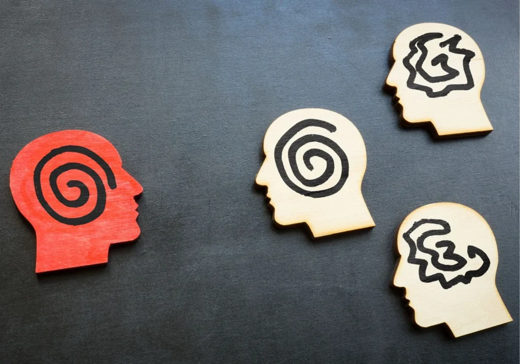 Magnets of human heads with symbols on them
