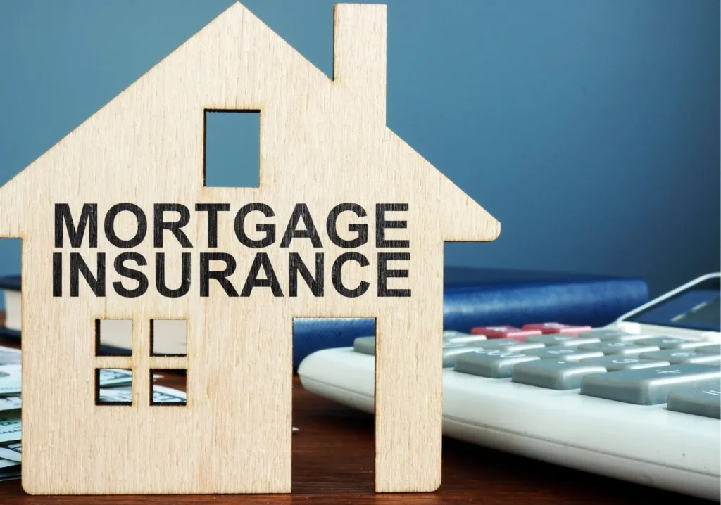Model of house with words mortgage insurance written on it