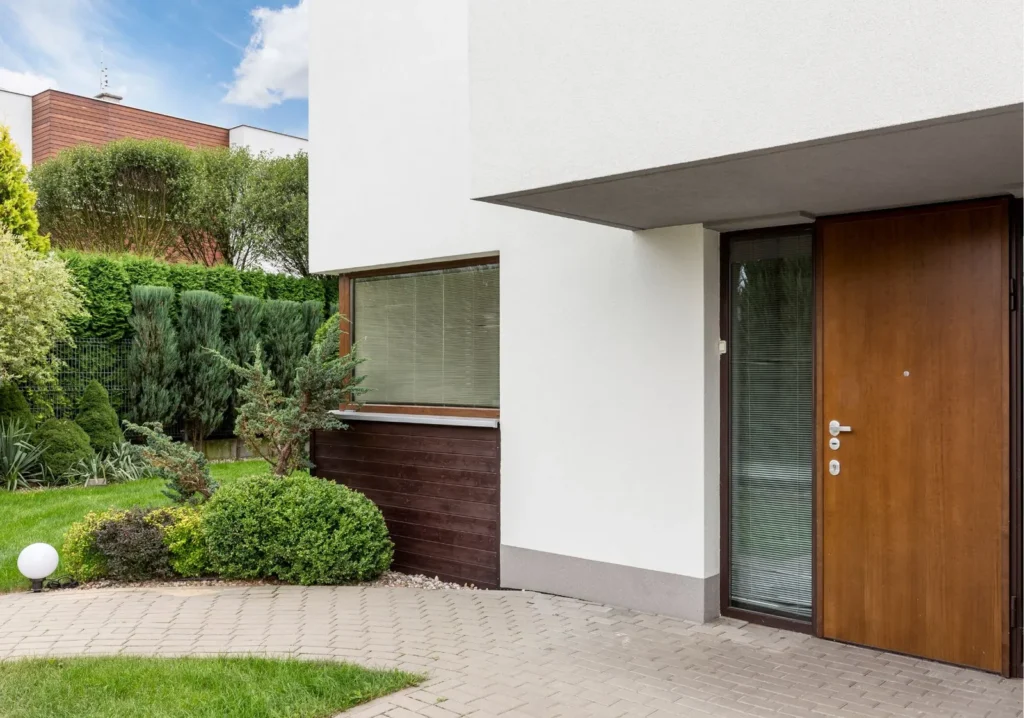 Modern white home with wood front door