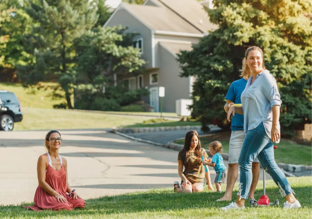 Neighbors walking and playing on the sidewalk of community