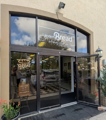 Outside Landert Bread store front with sign