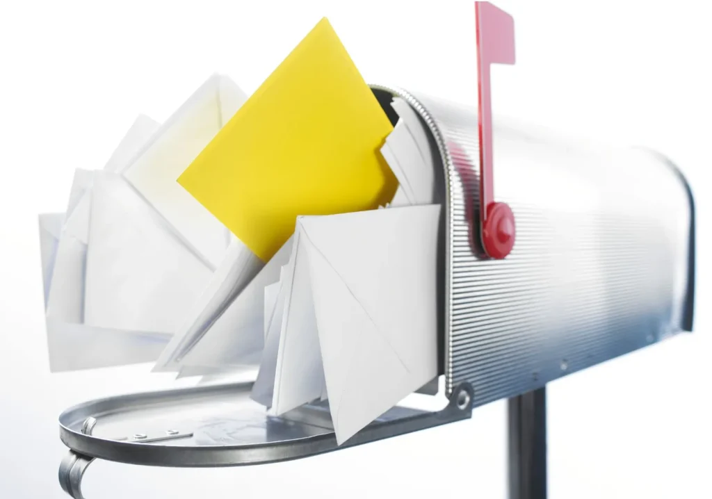 Overstuffed mailbox at a seasonal home