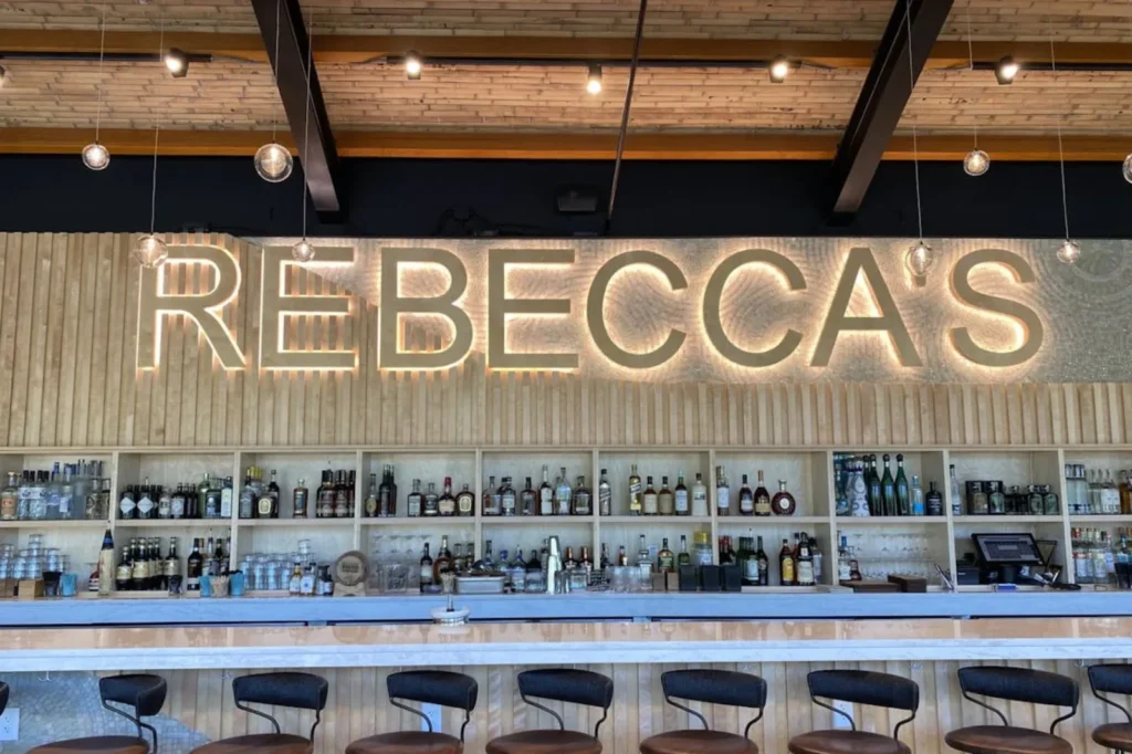 Rebecca's bar with backlit sign in the Bayshore Arts District