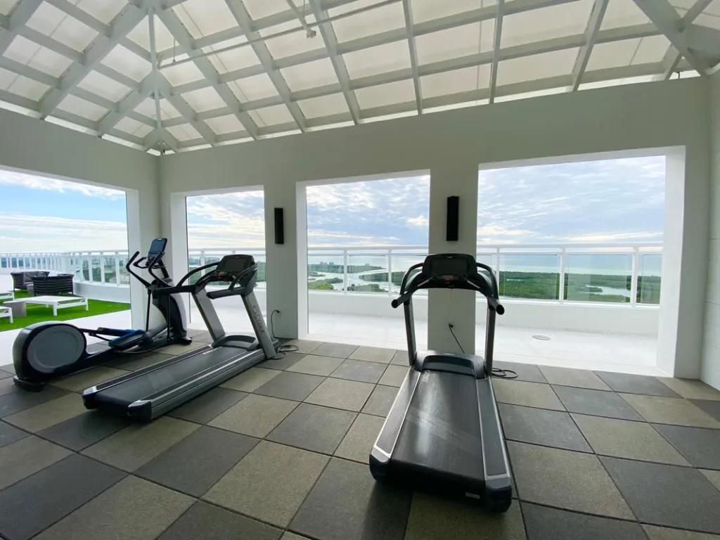 Fitness center with Gulf views at Kalea Bay