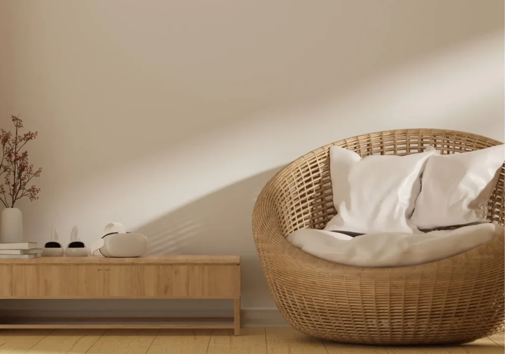 Round rattan chair with 2 white pillows