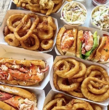 Seafood and fried onion rings at Maine Shack