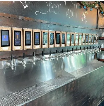 Self-pour beer tap wall at The Industry Standard