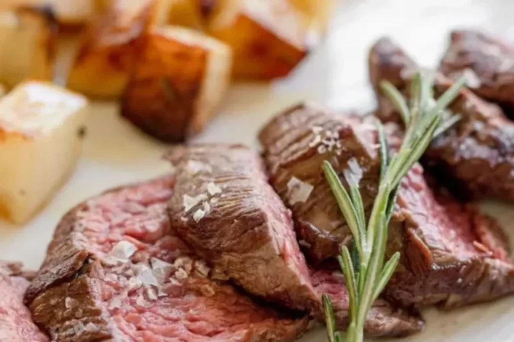 Sliced steak with rosemary at Casa Cotzelli