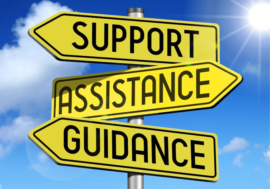 Street signs saying, support, assistance and guidance pointing in different directions