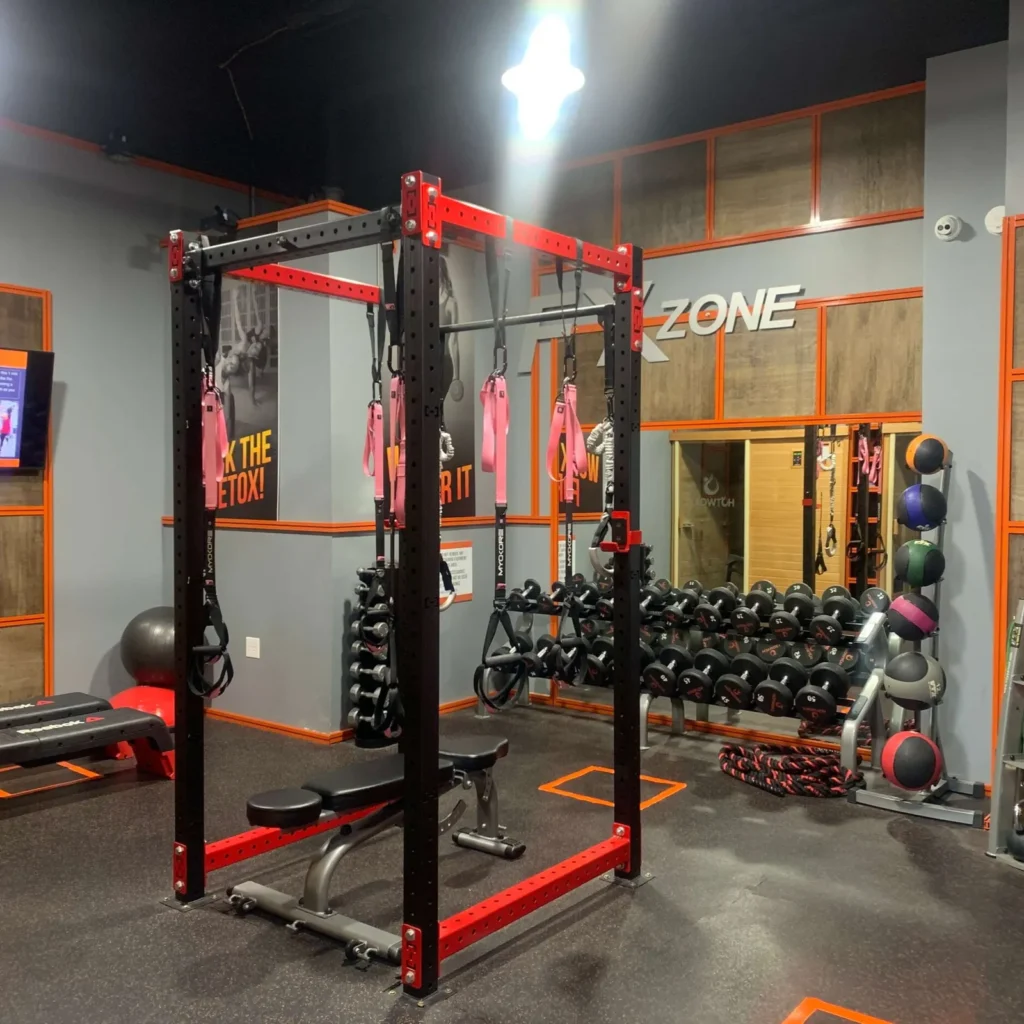Strength training area with weights at HOTWORX