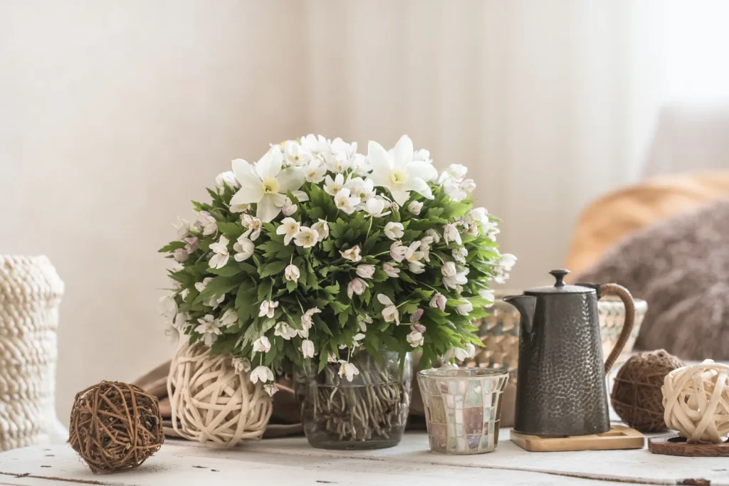 Tablescape with white and neutral accessories and flowers