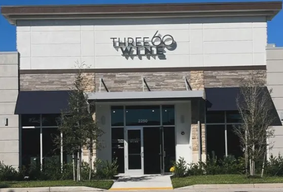 Three60 Wine at Logan Landings store front with sign
