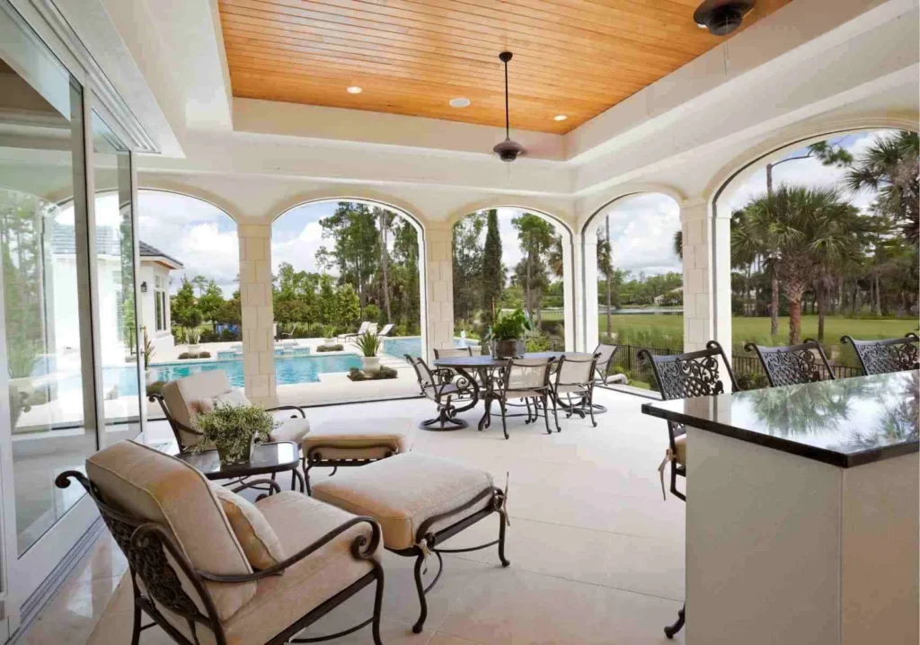 Upscale outdoor lanai living space with archways